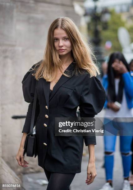 Polish model Magdalena Frackowiak wearing a black jacket is seen outside Balmain during Paris Fashion Week Spring/Summer 2018 on September 28, 2017...