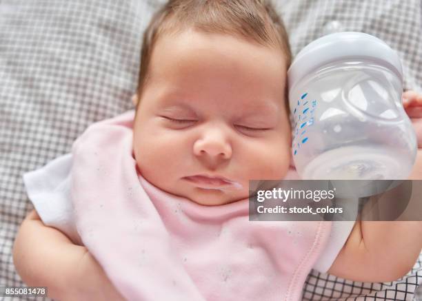 cutie baby girl sleeping - baby bib stock pictures, royalty-free photos & images