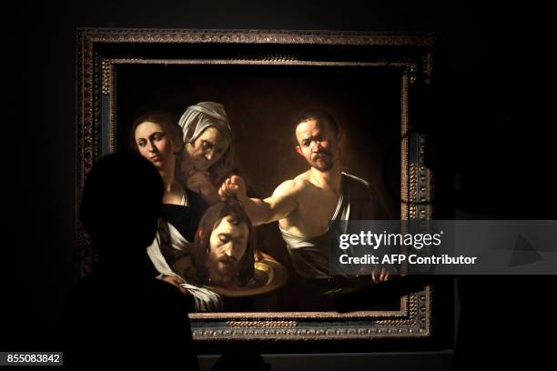 The oil painting on canvas called "Salome con la testa del Battista" by Italian painter Michelangelo Merisi, better known as Caravaggio is displayed...