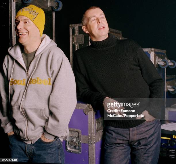 Chris Lowe and Neil Tennant of English synth-pop duo Pet Shop Boys posed with flight cases in 2002.