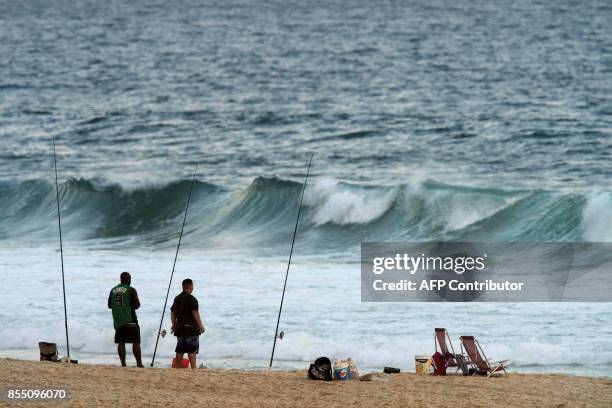 Rocinha residents fish in Sao Conrado beach in Rio de Janeiro, Brazil, on Septemper 27, 2017. Residents of chic neighborhoods nearby Rocinha -and...