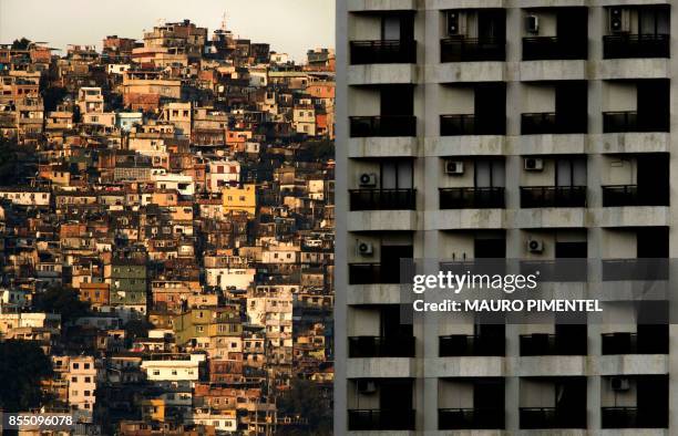 View of Rocinha favela, in the background of a building of Sao Conrado neighborhood, the closest and one of the richest areas of Rio de Janeiro on...