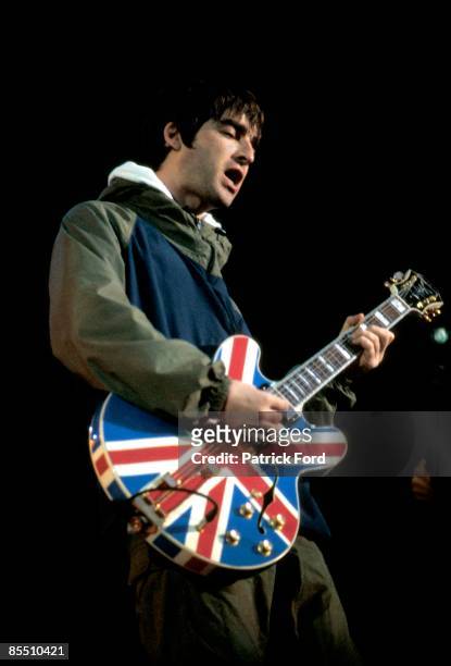 Photo of Noel GALLAGHER and BRITPOP and OASIS; Noel Gallagher performing live onstage, playing Epiphone Union Jack guitar at Maine Road, Britpop
