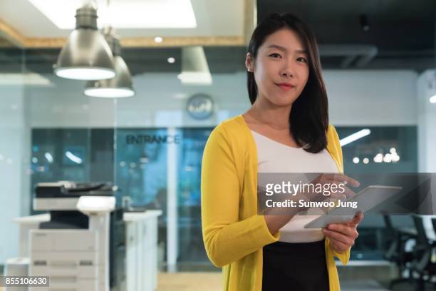 portrait of business woman in modern office - korea technology stock pictures, royalty-free photos & images