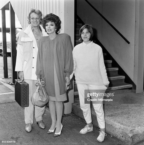 Joan Collins arrives at LAP from Los Angeles with her boyfriend Peter Holm and daughter Katyana Kass, 12th April 1985.