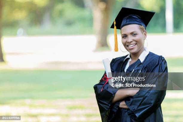 proud med school graduate - medical school graduation stock pictures, royalty-free photos & images