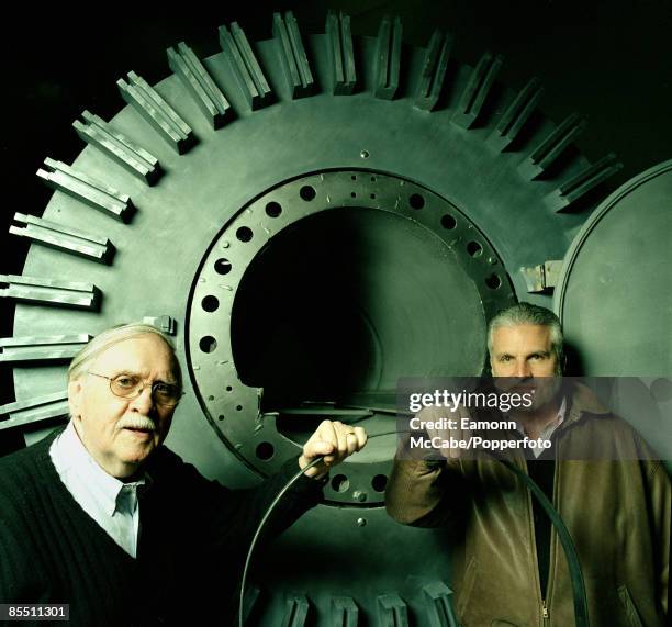 American playwright Thomas Meehan stands on left with American poet J. D. McClatchy with the torture machine on the set of the opera 1984 at the...