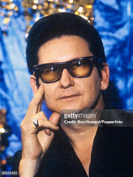 American singer Roy Orbison posed backstage in London circa 1965.