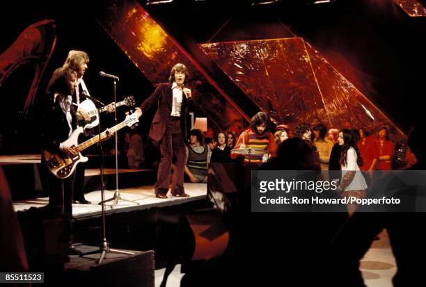 Pop group The Bee Gees perform in front of a studio audience on the set of a pop music television show in London circa 1970. Members of the band are,...