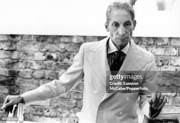 English drummer Charlie Watts of the Rolling Stones posed wearing a double breasted suit on 29th June 1992.