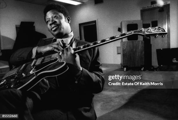 Photo of BB KING, playing the guitar in the recording studio