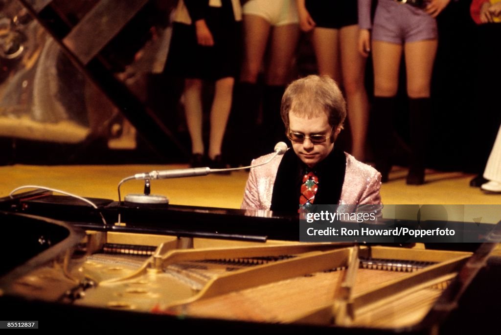 English singer and pianist Elton John performs at a grand piano on ...
