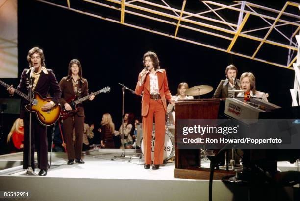 Scottish Pop Group Bay City Rollers perform on the set of a pop music television show in London in September 1971. Members of the band are, from...