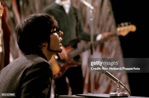 Keyboard player Manfred Mann of English rock group Manfred Mann performs on the set of a pop music television show in London circa 1966.