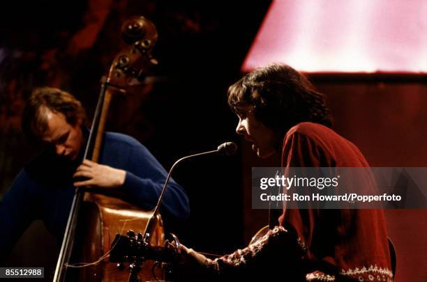 Scottish singer and musician Donovan performs with English double bassist Danny Thompson on the set of a pop music television show in London circa...