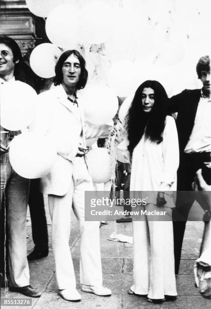 Photo of John LENNON; while in The Beatles, posed with Yoko Ono at the opening of John's You Are Here exhibition at the Robert Fraser Gallery, Mayfair