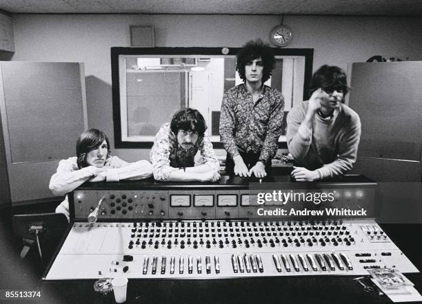 Photo of PINK FLOYD; L-R: Roger Waters, Nick Mason, Syd Barrett, Rick Wright - posed, group shot, at mixing desk in recording studio control room