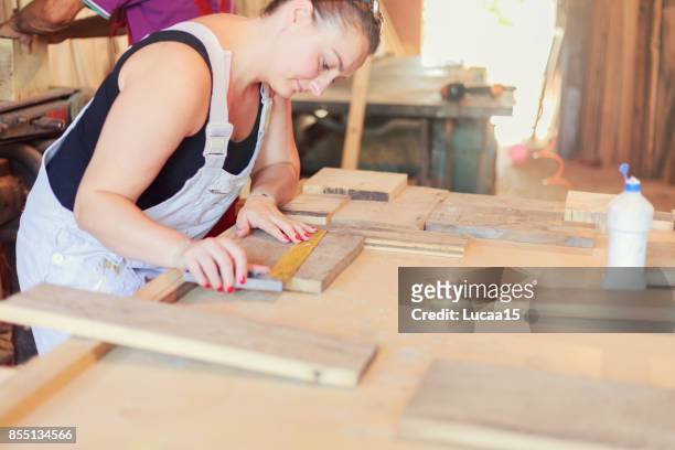 female carpenter - finanzwirtschaft und industrie stock pictures, royalty-free photos & images