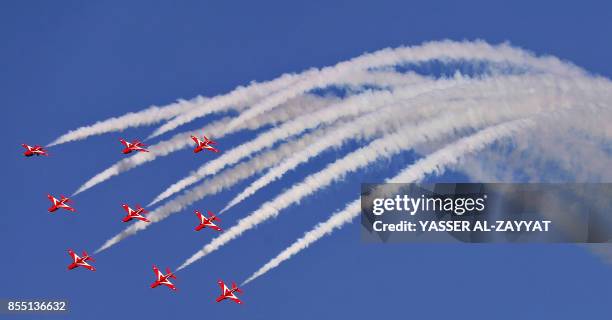 The British Royal Air Force's aerobatic team, the "Red Arrows", performs aerial manoeuvres during an airshow in Kuwait City on September 28, 2017.