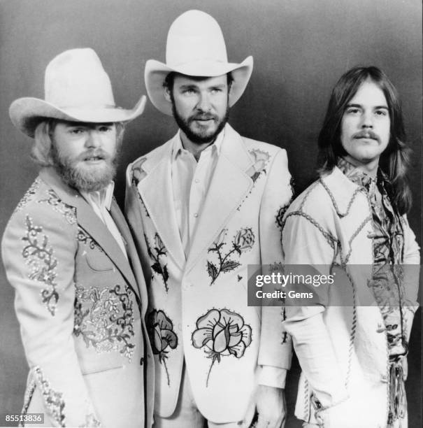 Photo of Dusty HILL and ZZ TOP and Frank BEARD and Billy GIBBONS; L-R: Dusty Hill, Billy Gibbons, Frank Beard - posed, studio, group shot