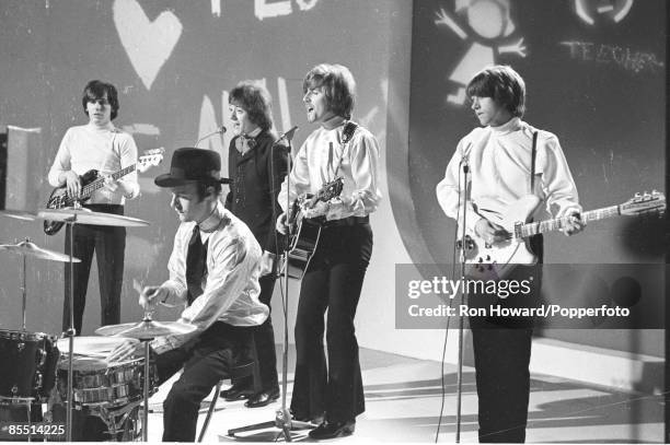 English rock and pop group The Hollies perform on the set of a pop music television show in London in June 1967. Members of the band are, from left,...