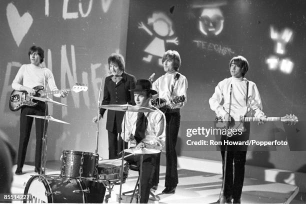 English rock and pop group The Hollies perform on the set of a pop music television show in London in June 1967. Members of the band are, from left,...