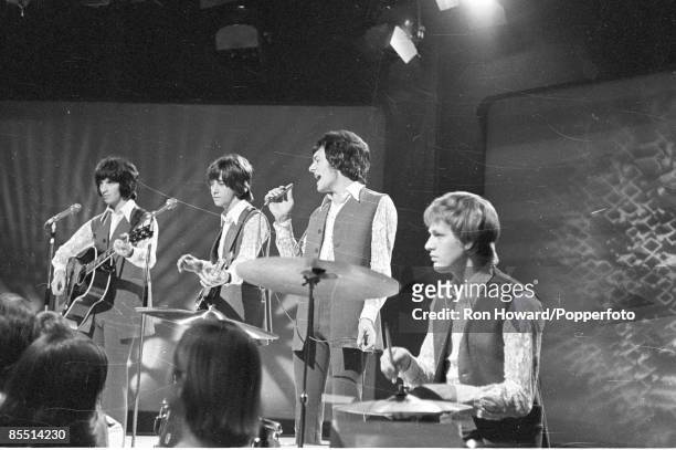 English rock and pop group The Hollies perform on the set of a pop music television show in London in October 1969. Members of the band are, from...