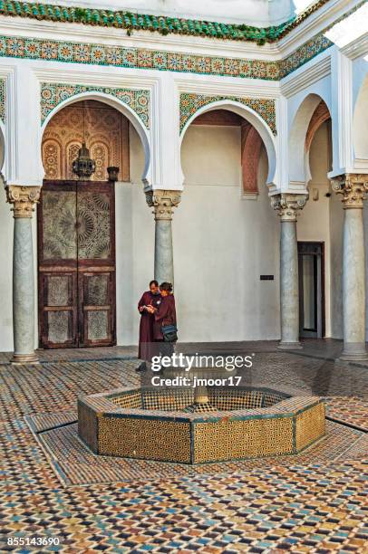 casbah tangier in morocco interior features with man and woman - casbah stock pictures, royalty-free photos & images