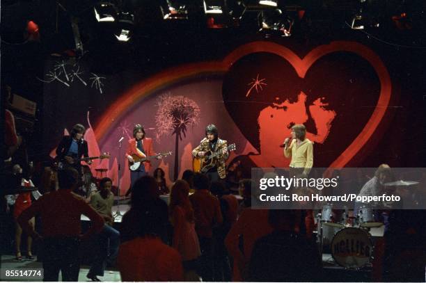English rock and pop group The Hollies perform on the set of a pop music television show in London in February 1972. Members of the band are, from...