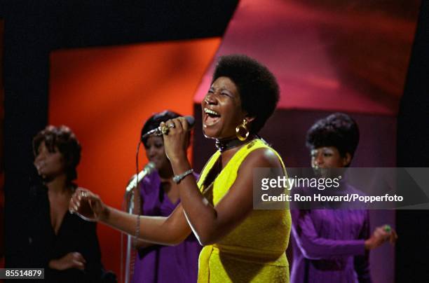 American Singer Aretha Franklin performs on the set of a pop music television show in London circa July 1970.
