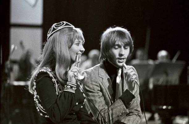 Scottish singer Lulu performs with Maurice Gibb of the Bee Gees on the set of a pop music television show in London circa 1969.