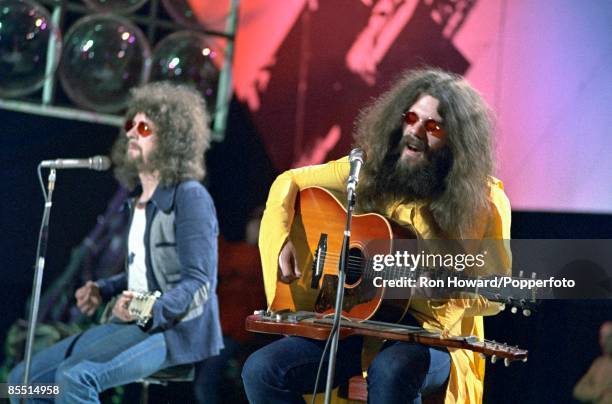 From left, Jeff Lynne and Roy Wood of the Electric Light Orchestra perform on the set of a pop music television show in London circa 1970.