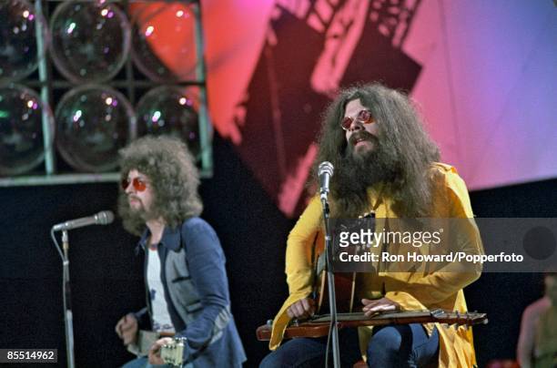 From left, Jeff Lynne and Roy Wood of the Electric Light Orchestra perform on the set of a pop music television show in London circa 1970.