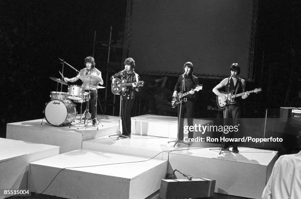 English group The Tremeloes perform on the set of a pop music television show in London circa 1968. Members of the band are, from left, drummer Dave...