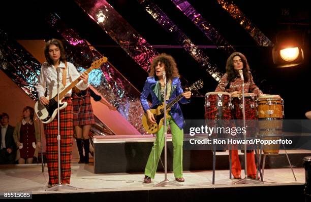 English rock band T. Rex perform on the set of a pop music television show in London circa 1970. Members of the group are, from left, Steve Currie ,...