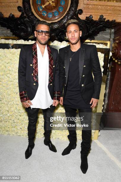 Daniel Alves and Neymar attend the Balmain show as part of the Paris Fashion Week Womenswear Spring/Summer 2018 on September 28, 2017 in Paris,...