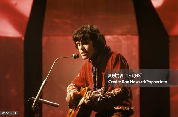 Scottish singer and musician Donovan performs on the set of a pop music television show in London circa 1969.