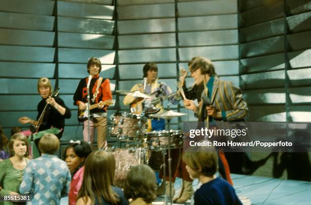 English group Dave Dee, Dozy, Beaky, Mick & Tich perform on the set of a pop music television show in London circa 1968. Members of the group are,...