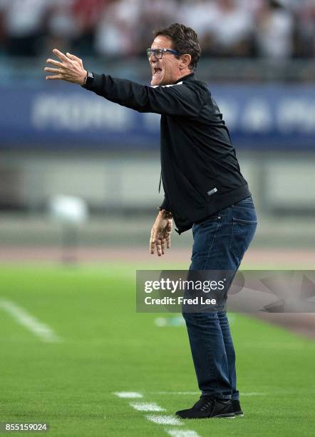 Jiangsu FC head Coach Fabio Capello shouts instructions to his players during the China Super League match between Jiangsu FC and Tianjin Quanjian FC...