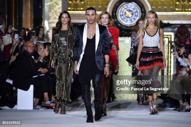 Designer Olivier Rousteing and models Alessandra Ambrosio,Natalia Vodianova and Natasha Poly walk the runway during the Balmain show as part of the...