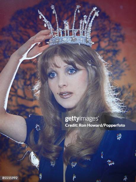 English Singer Lynsey de Paul posed wearing a crown, circa 1974.