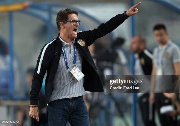 Jiangsu FC head Coach Fabio Capello shouts instructions to his players during the China Super League match between Jiangsu FC and Tianjin Quanjian FC...