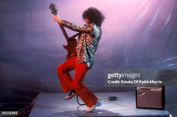 Photo of T REX and Marc BOLAN; filming 'Born To Boogie', playing guitar