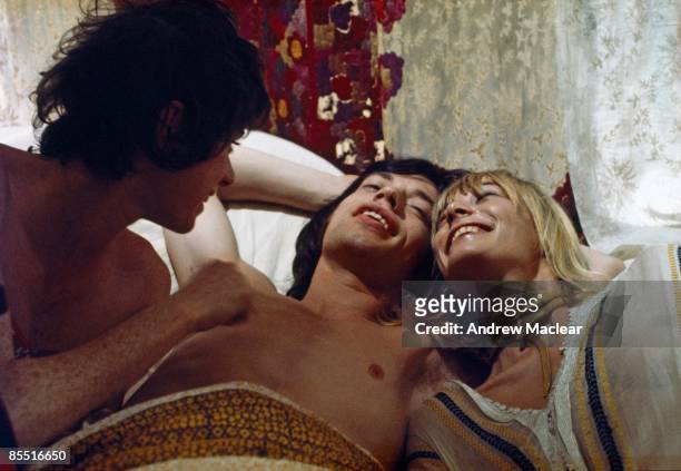 Photo of Mick JAGGER and Anita PALLENBERG and Michele BRETON; L-R: Michele Breton, Mick Jagger, Anita Pallenberg on set of film Performance
