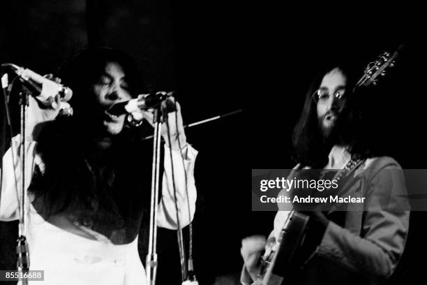 Photo of John LENNON and Yoko ONO, Yoko Ona and John Lennon performing on stage with the Plastic Ono Band at UN Childrens Fund concert