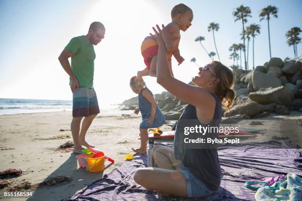 young family plays on the beach. - ventura california stock pictures, royalty-free photos & images