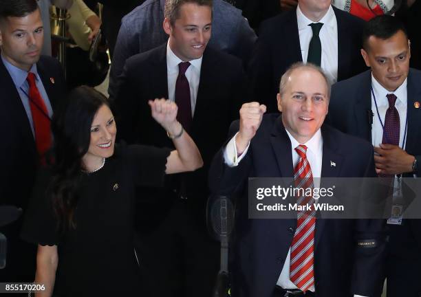 House Republican Whip Steve Scalise stands with his wife Jennifer as he reacts to cheers after returning to the Capitol Hill for the first time after...