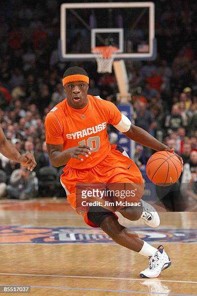 Jonny Flynn of the Syracuse Orange dribbles the ball against the Connecticut Huskies during the quarterfinals of the Big East Tournament at Madison...