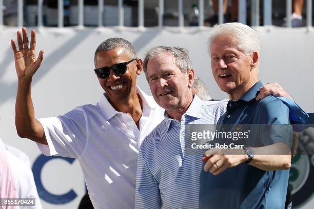 Former U.S. Presidents Barack Obama, George W. Bush and Bill Clinton attend the trophy presentation prior to Thursday foursome matches of the...