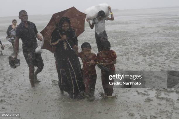 Rohingya refugees walk toward refugee camp after crosses Myanmar-Bangladesh border at Teknaf in Bangldesh on September 28, 2017. Violence erupted in...